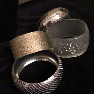 Bundle of chunky bangles .